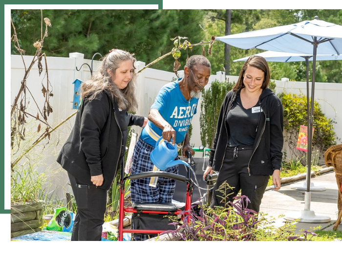 elderly watering plants